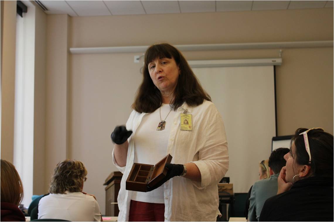 Karie Dietham showing off some of the artifacts in Independence National Historical Park’s Archives