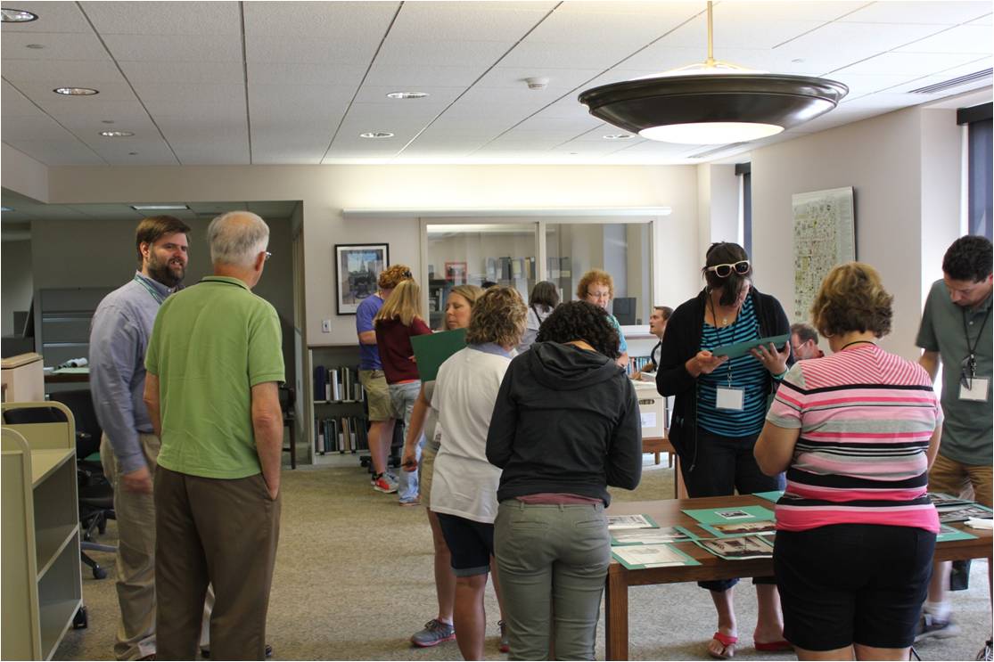 Master Teacher Ivan Jurin and the teachers looking at selections from the archives of Independence National Historical Park