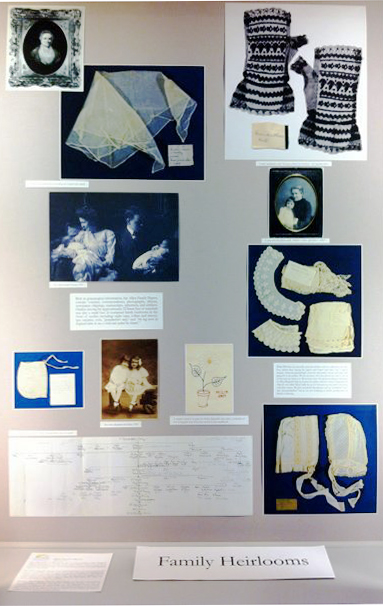 Display of items from the Allen family papers, including textiles and family tree